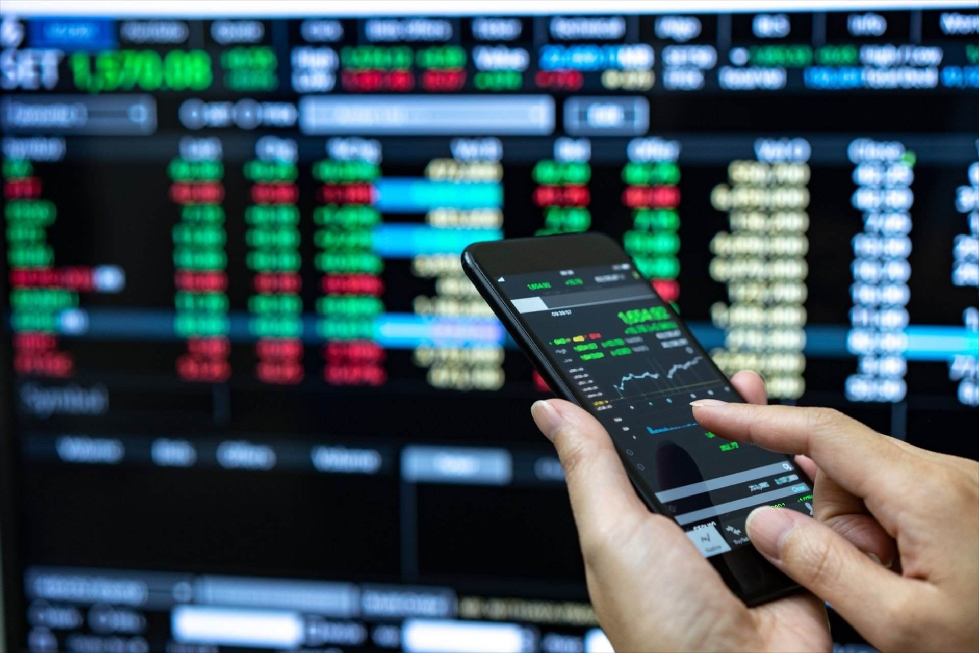 EuropaPress 5356115 businessman checking stock market data he using mobile phone analysis