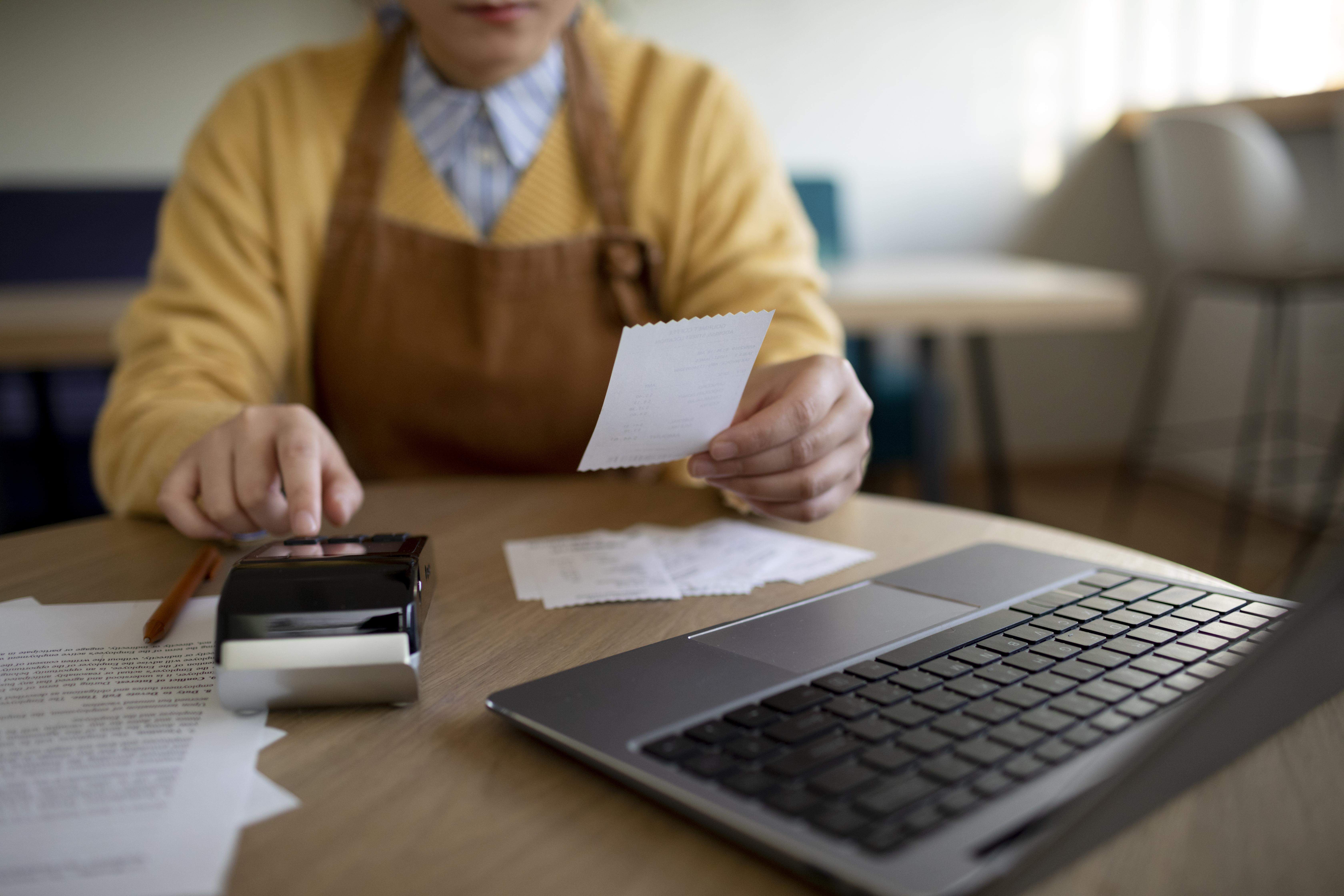 close up hand holding receipt