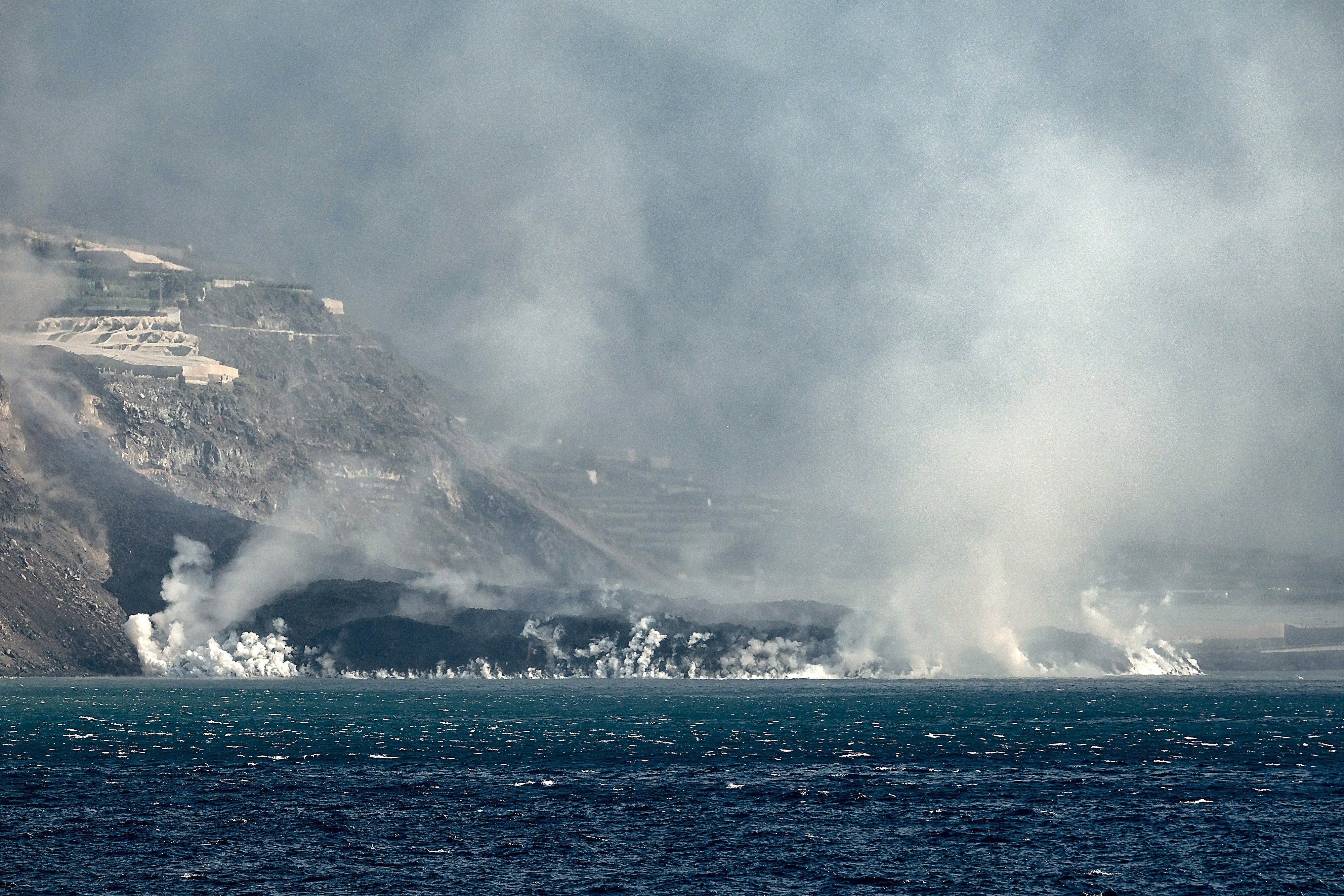 La Palma volcano's lava tongue reclaiming land from ocean along a quarter-mile front