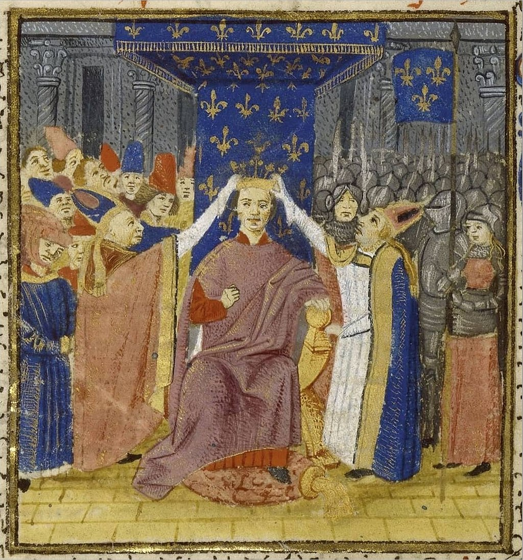Representació de la coronació de Carles VII de França (segle XV). A la dreta Joana d'Arc amb vestuari masculí. Font Bibliothèque Nationale de France