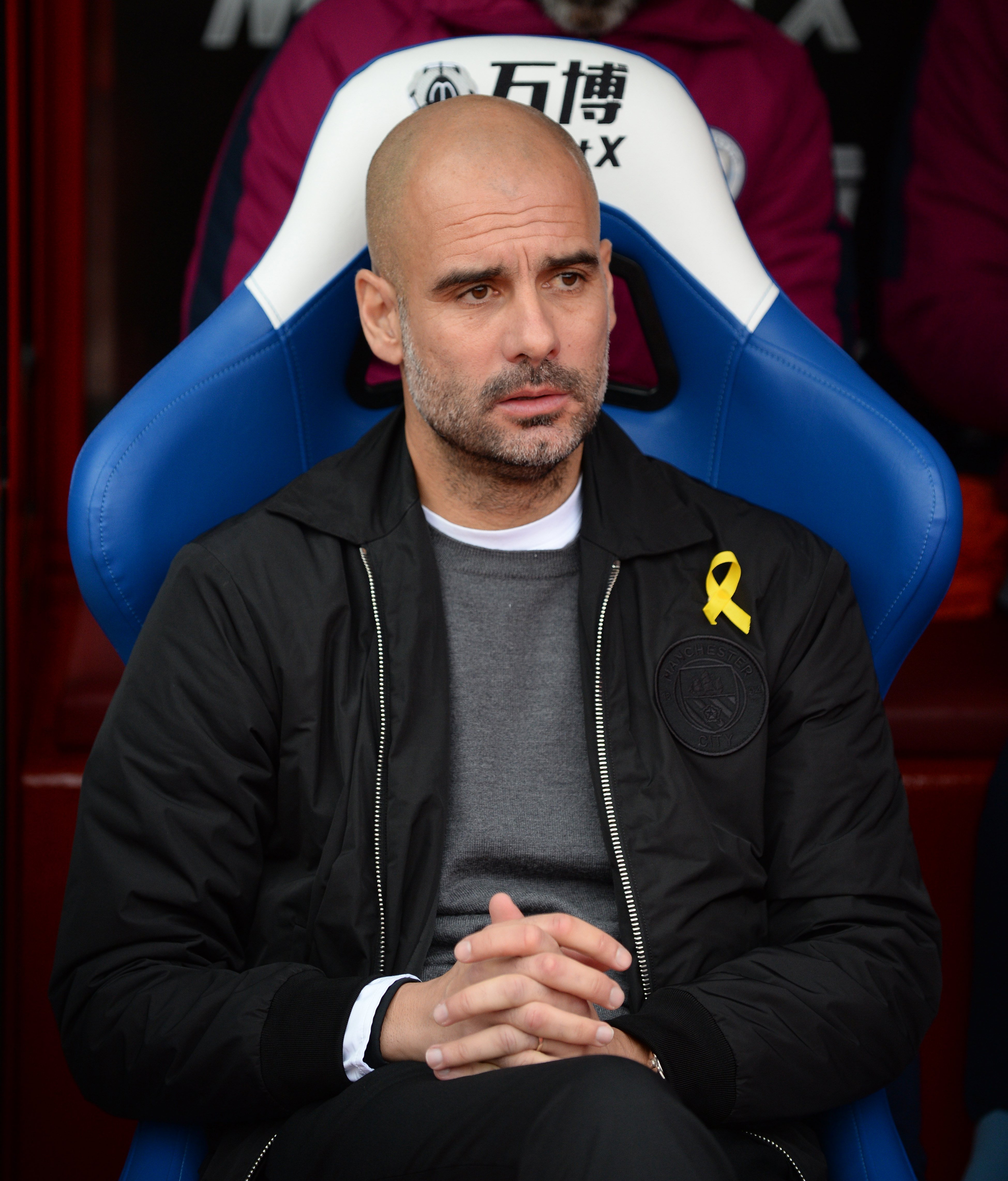 FA charges Pep Guardiola for wearing a yellow ribbon loop