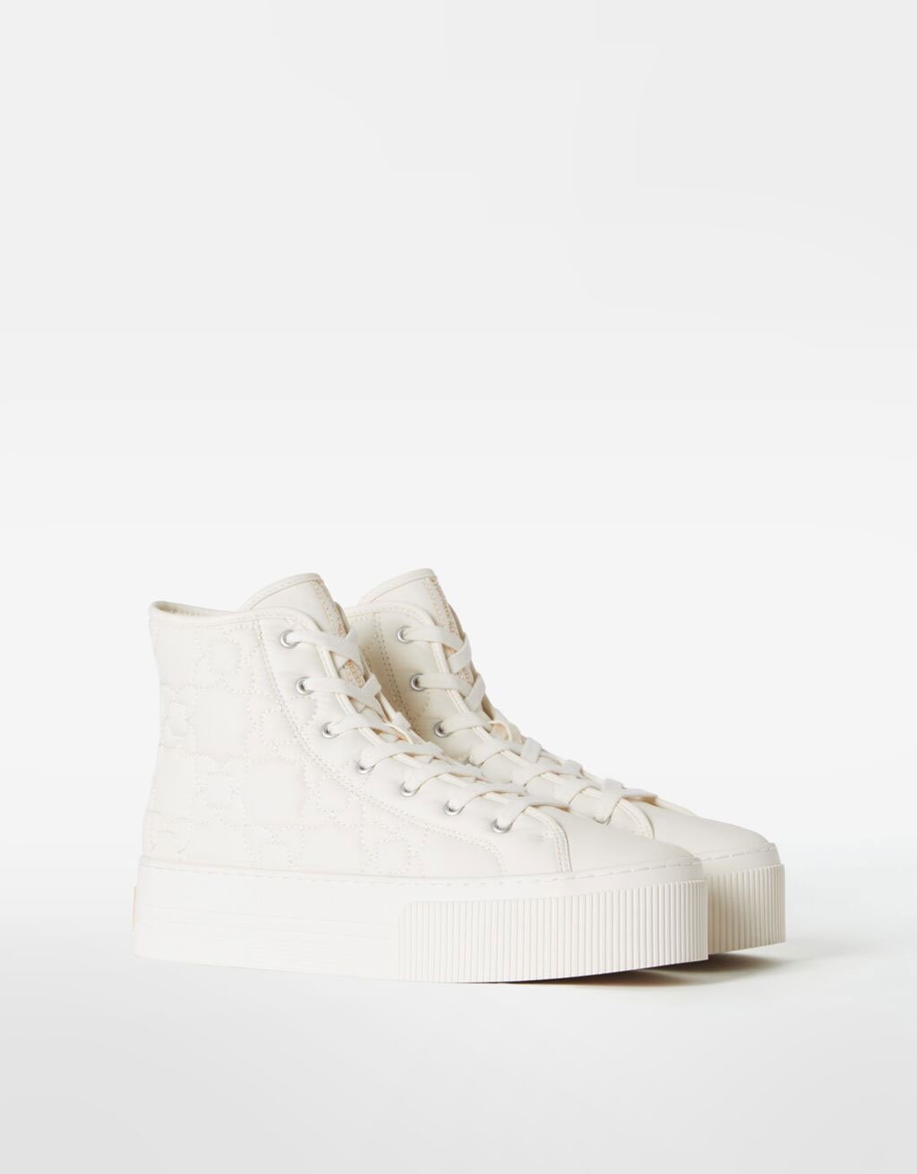 Sabatilles abotinadas embuatades amb plataforma