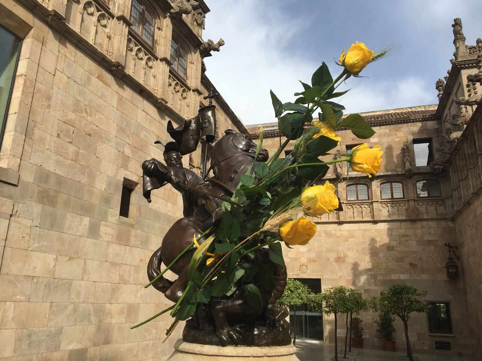 Catalan government palace surrounded by yellow roses