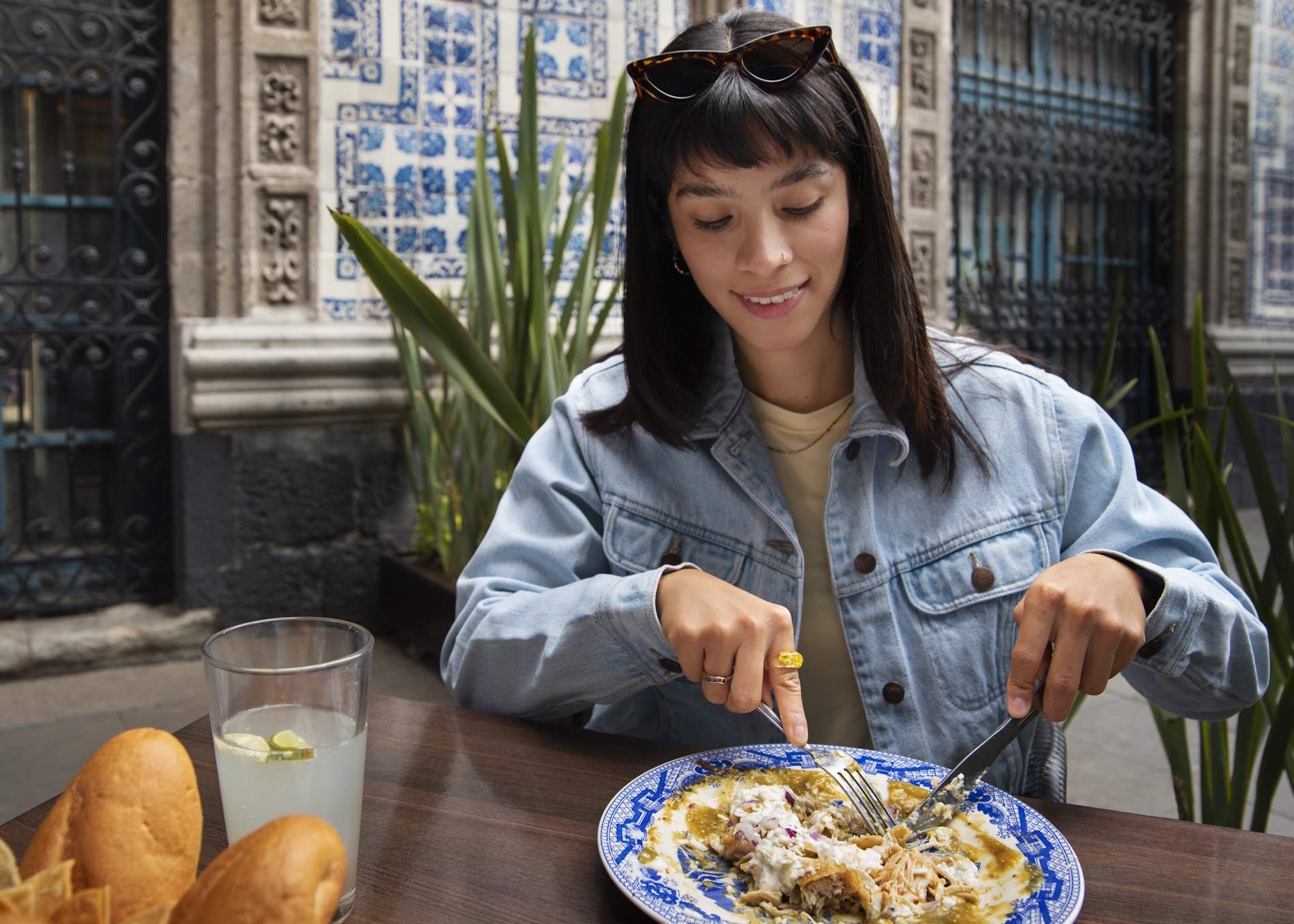 front view mexican woman eating ranchero food (1)