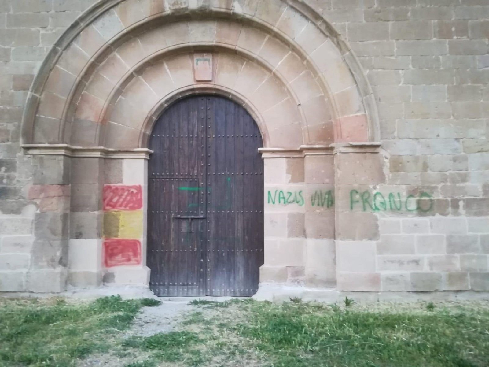 Medieval monastery sprayed with Spanish nationalist graffiti on eve of festival