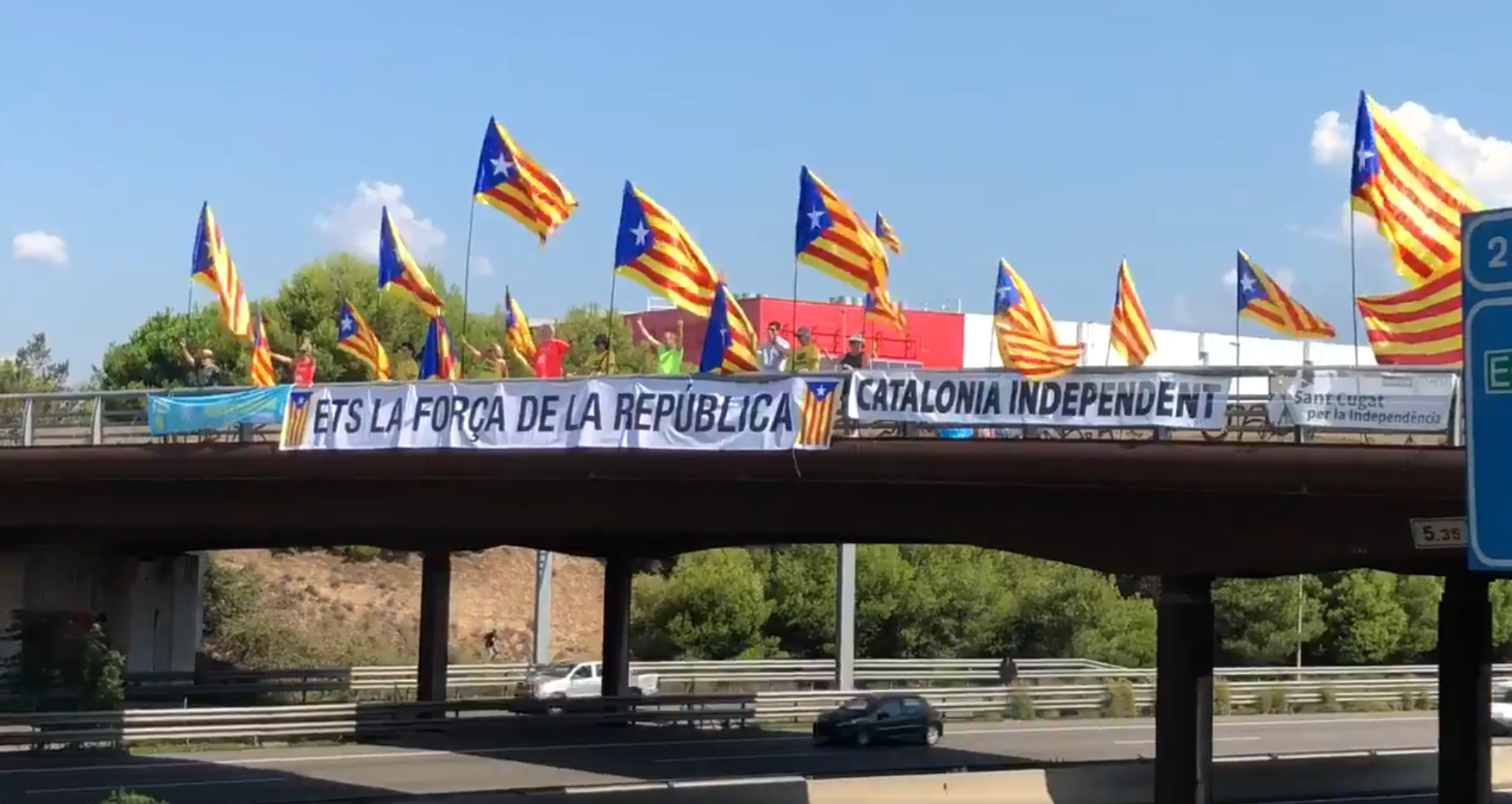 Catalan motorway bridges turn red, yellow and blue in independence protest