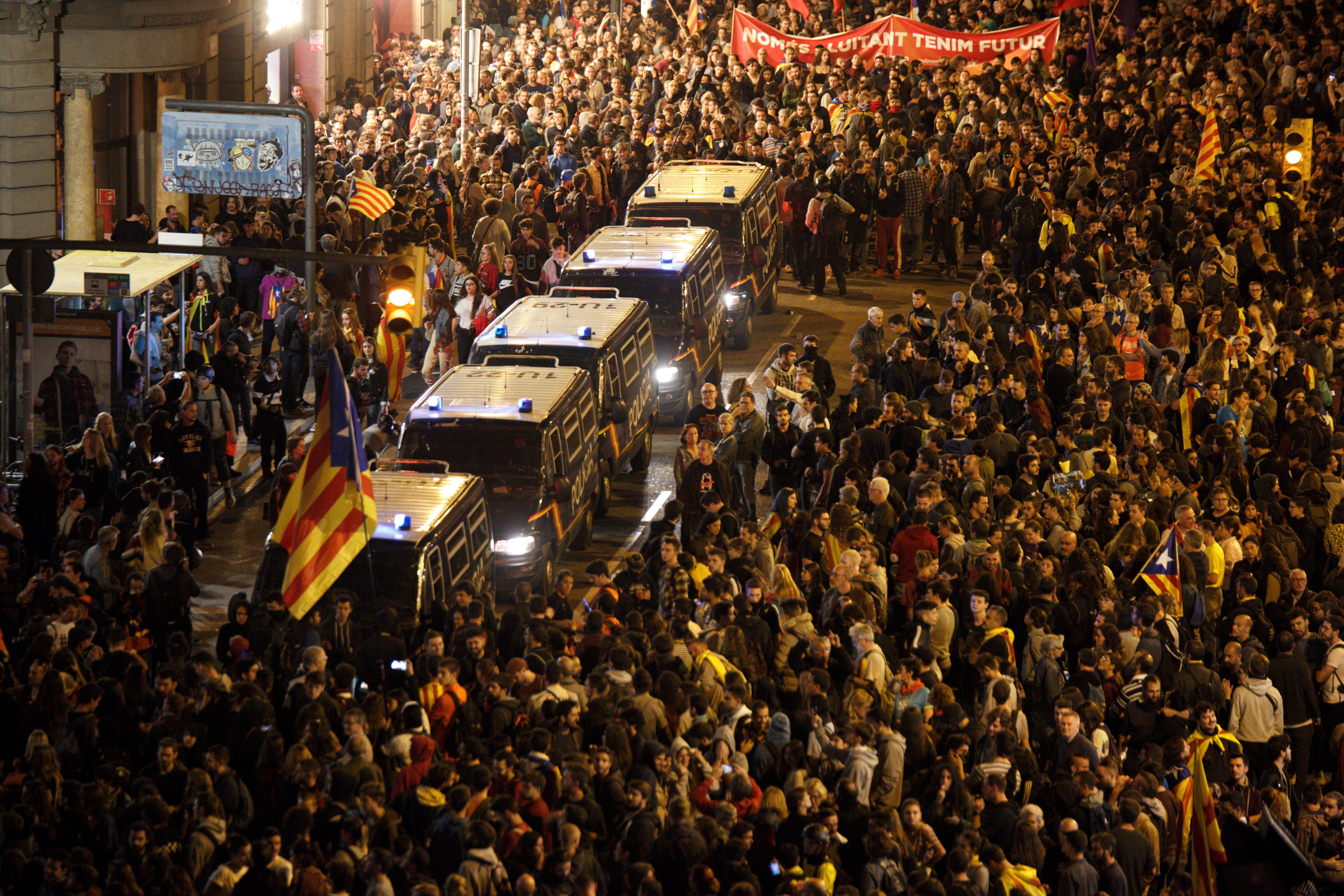 Riot squads act against protesters outside Spanish police station in Barcelona