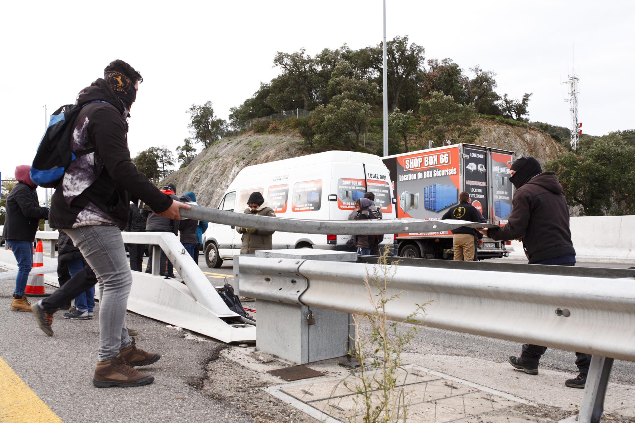 Videos: Catalan protesters block main road across French border