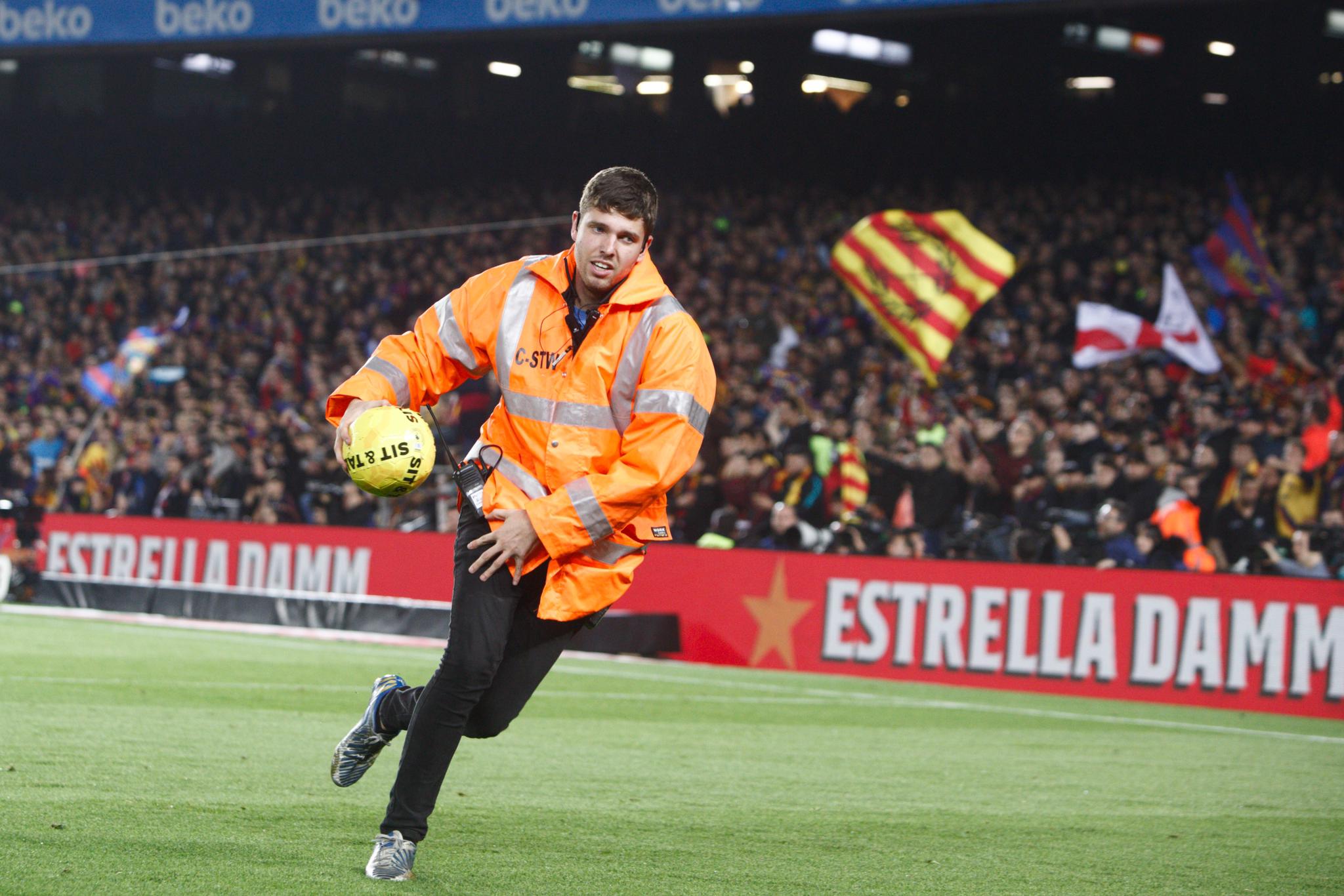 El Clásico: Balls thrown onto the pitch pause the match, but Messi masks confiscated